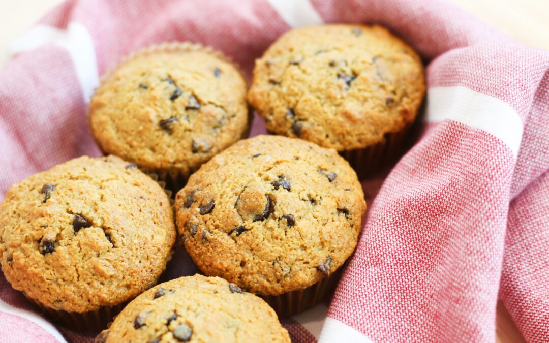 chocolate chip muffins in a red towel